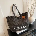 Large capacity leopard print canvas tote bag with bold TOTE BAG lettering print - Brown