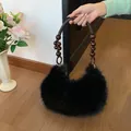 Chic black faux fur handbag featuring unique dark brown beaded and woven rope handles - Black