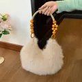 Chic beige plush faux fur handbag with bohemian beaded handle for women stylish autumn style - Khaki