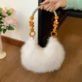 Chic white plush handbag with orange and white beaded handle for women stylish通勤 look - Off White
