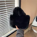 Chic black plush handbag made of soft faux fur with a cozy texture for winter - Black