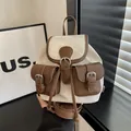 Mini beige canvas backpack with brown leather trim and silver buckle accents - Off-White