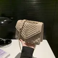 Chic beige quilted shoulder bag with gold chain strap and tassel hardware detail - Khaki