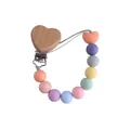 Pastel silicone pacifier clip with beech wood heart clamp and colorful round beads - Rose Pink