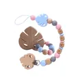 Silicone and beech wood baby pacifier clip with leaf teether in pink and blue colors - Set / Blue