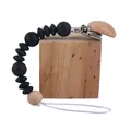 Baby pacifier clip with black silicone beads and natural beech wood for secure attachment - Black