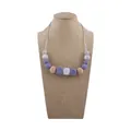 Silicone baby teething necklace featuring purple, marble grey and wooden beads - Lilac Purple