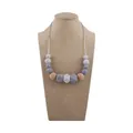 Silicone and wood teething necklace with gray geometric beads on display stand - Gray