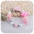 Sujeta chupetes de silicona con corazón I LOVE MOM y cuentas con letras de BABY - Amo a Mamá / Rosa