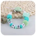Sujeta chupetes de silicona con cuenta de corazón I Love Dad y bloques de letras BABY - Amo a Papá / Verde