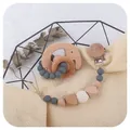 Beech wood elephant teether set with silicone pacifier clip and crochet beads on soft background - Dark Gray
