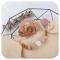 Beechwood elephant teether and silicone pacifier clip set in natural earthy tones - Light Coffee