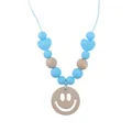 Blue silicone and natural wood teething necklace with a smiling face wooden pendant - Blue