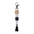 DIY keychain with black and white silicone beads, wooden cube, and a black tassel - Black