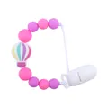 Pink and purple silicone pacifier clip with colorful hot air balloon charm for infants - Purple