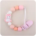 Pink silicone unicorn pacifier clip with baby teething beads and secure safety clasp - Pink