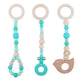 Wooden animal teether pendant set with mint green silicone beads and bird charm - Green