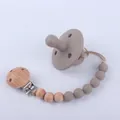 Silicone baby pacifier and matching clip set with natural wood beads in taupe color - Dark Gray-brown