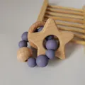 Detail of baby teething ring featuring star beech wood and purple silicone beads - Lilac Purple