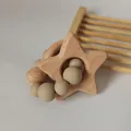 Detail of wooden star teether and silicone bead bracelet for baby sensory play - Khaki