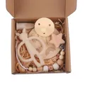 Close-up of baby gift set including silicone bunny teether and wooden pacifier clip in a box - Beige Rabbit Five-piece Set