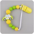 Silicone pacifier clip with yellow beads and a blue police car teething pendant - Yellow