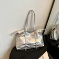 Modern metallic silver tote bag with decorative straps and silver metal buckles - Silver