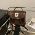Close-up of vintage plaid wool handbag with leather trim and bear pattern patch - With Pendant / Coffee