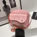 Pink canvas crossbody bag featuring cute sausage dog print and wave-edge flap detail - Pink