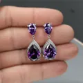 Luxuriöse lila Amethyst-Ohrhänger in Tropfenform mit Silberfassung und Zirkonia - Lila