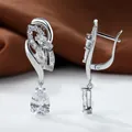 Detailed view of silver dangle earrings with pear-cut cubic zirconia and leverback closure - White Gold With White Zirconia
