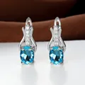 Orecchini dorati eleganti con cristalli ovali blu cielo e dettagli in zirconi scintillanti - Placcato Platino Blu Acqua