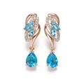 Elegant champagne gold drop earrings with pink diamonds and pear-cut blue gemstones - Champagne Gold Aqua Blue