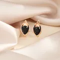 Boucles d'oreilles créoles dorées avec un zircon noir en forme de poire sur soie - Noir