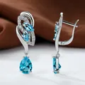 Silver drop earrings with pear-shaped sky blue stones and cubic zirconia accents - Platinum Plated Aqua Blue