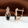 Elegante Ohrringe in Roségold mit ovalem schwarzem Kristall und weißen Zirkonia-Akzenten - Champagner Gold Schwarz