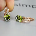 Rose gold earrings with oval green zircon and white accent stones in a leverback style - Champagne Gold Olive Green