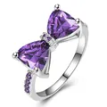 Elegant silver bow ring featuring purple triangle zircon gemstones and pavé accents - US 7 / Platinum Plated Purple Zirconia