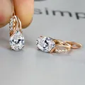 Oval light blue zircon earrings with champagne gold plating and pave-set accents - Champagne Gold White Stone