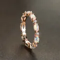 Elegant rose gold oval opal ring with sparkling white zircon accents in a minimalist design - US 6 / Gold