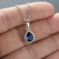 Pear cut dark blue teardrop pendant necklace with sparkling white stone halo - White Gold Sapphire Blue