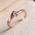 Classic rose gold ring with a sparkling round center stone and diamond-set twisted band - US 5 / Rose Gold
