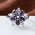 Detailed macro shot of a purple zircon flower ring with silver metal petal settings - Silver Purple Stone