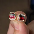 Macro shot of square gradient tourmaline stud earrings with micro-set diamonds - Gold-Tone Red Green