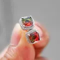 Macro detail of square-cut colorful gradient tourmaline stud earrings with halo diamonds - Platinum Plated Red Green