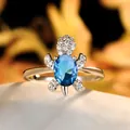 Elegante zilveren schildpadring met blauwe edelsteen en sprankelende zirkoonkristallen - Maat 6 / Blauw Groen Toermalijnkleur Zirkonia