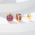 Detailed close-up of gold-plated round stud earrings with rose red zircon pavé stones - Gold Red Zirconia