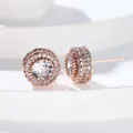 Close-up of rose gold micro-paved cubic zirconia round stud earrings with halo design - Rose Gold