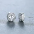 Macro detail of silver round halo stud earrings with micro-paved cubic zirconia stones - Platinum
