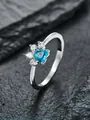 Anillo de plata con circonita corazón azul y piedras blancas diseño huella - Talla 5 / Zircón Azul Agua